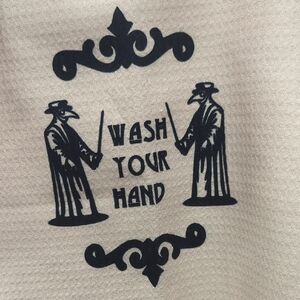 Beige Towel with Black Plague Doctor Design
